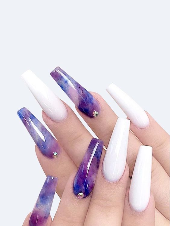 In this image show, the long color white and purple nails design.