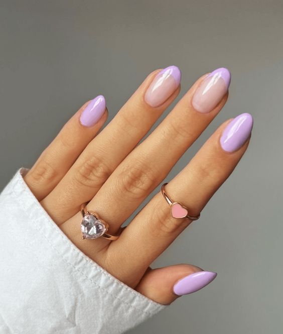 In this image show, the round shape of nails with this cute purpule color nails.
