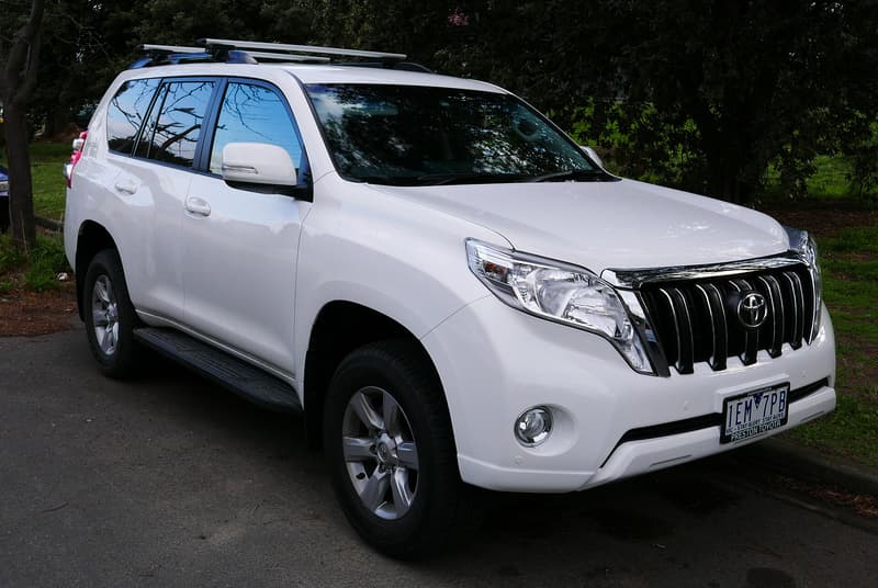 Toyota Land Cruiser Prado 150 (KDJ150R) GXL in white, front three-quarter view — right-hand drive