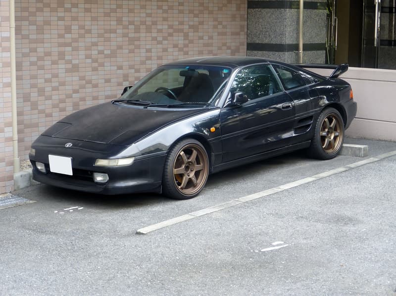 Toyota MR2 (SW20) G-Limited in black, front three-quarter view — right-hand-drive JDM model