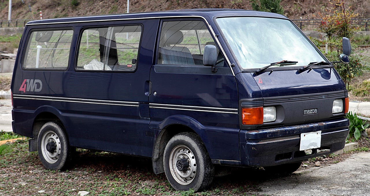 Dark blue third-generation Mazda Bongo van with a 4WD decal, front three-quarter view
