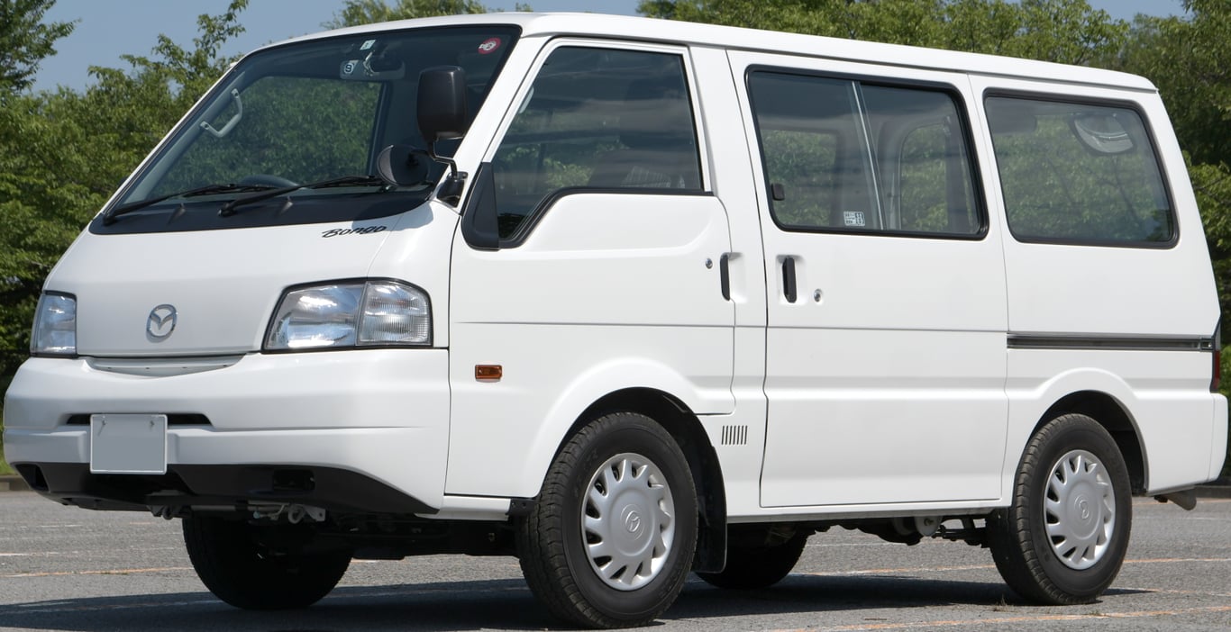 White fourth-generation Mazda Bongo van, front three-quarter view