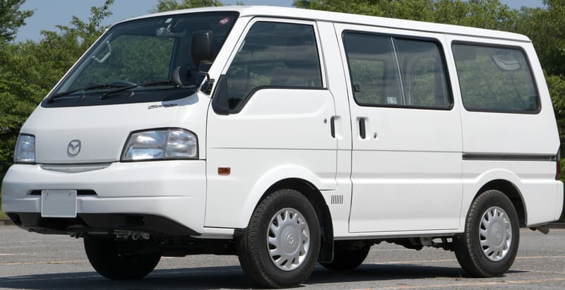 White fourth-generation Mazda Bongo van, front three-quarter view