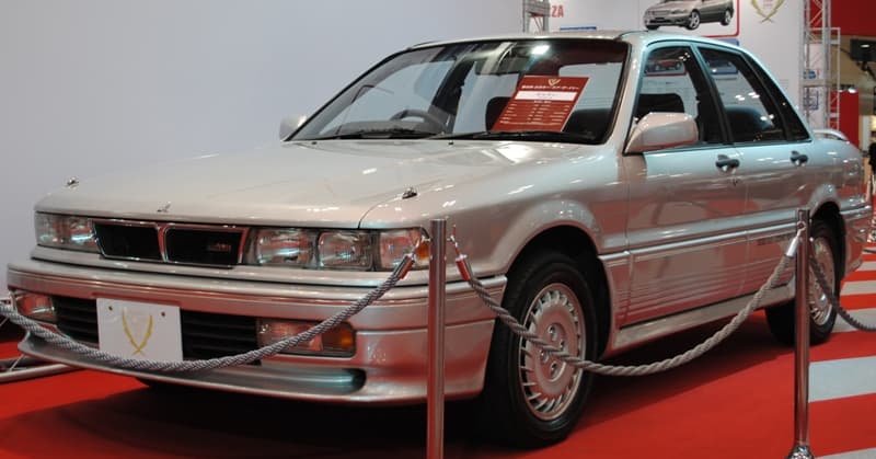 Silver sixth-generation Mitsubishi Galant VR-4 sedan, front three-quarter view