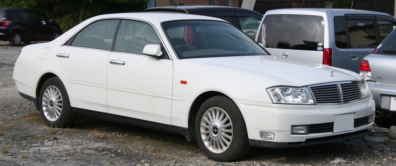 White Nissan Cedric Y34 four-door hardtop, front three-quarter view