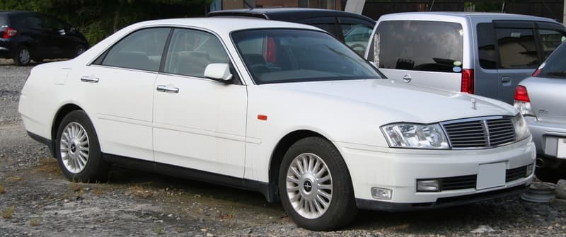 White Nissan Cedric Y34 four-door hardtop, front three-quarter view