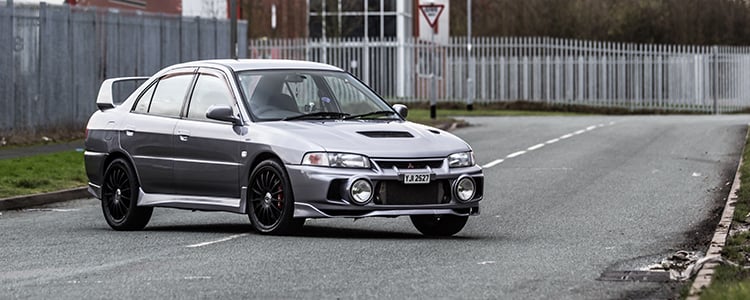 Mitsubishi Lancer Evo — hero image, three-quarter view