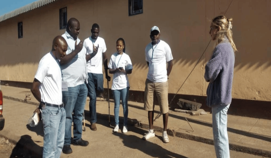 2. Photos_ Enumerators being briefed on randomization during data collection and research ethics.