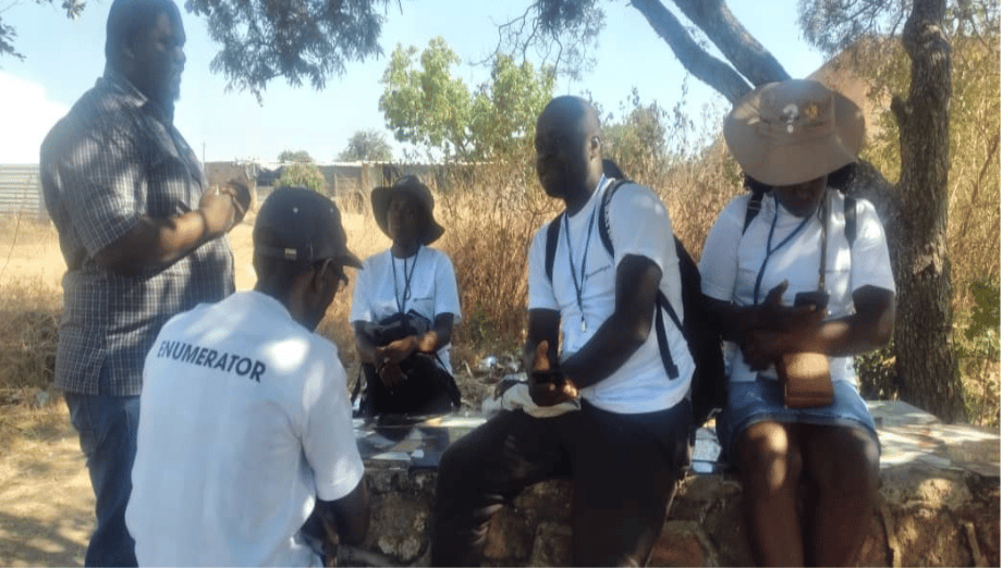 1. Photos_ Enumerators being briefed on randomization during data collection and research ethics.