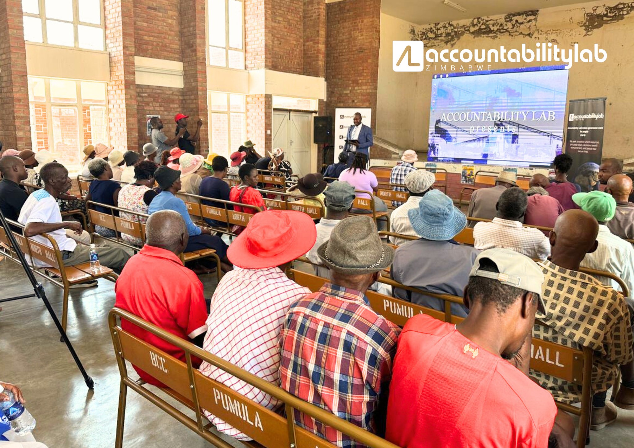 3. Images of duty bearers and Pumula residents watching Time Bomb, followed by a collaborative discussion on co-creating sustainable solutions to the challenges of urban mining