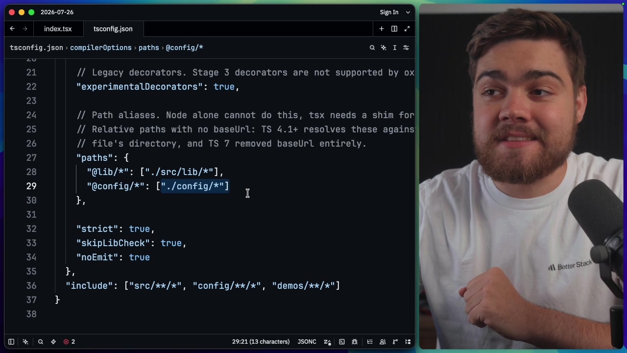 A screenshot of a `tsconfig.json` file, with the "paths" object highlighted to show how aliases are configured.