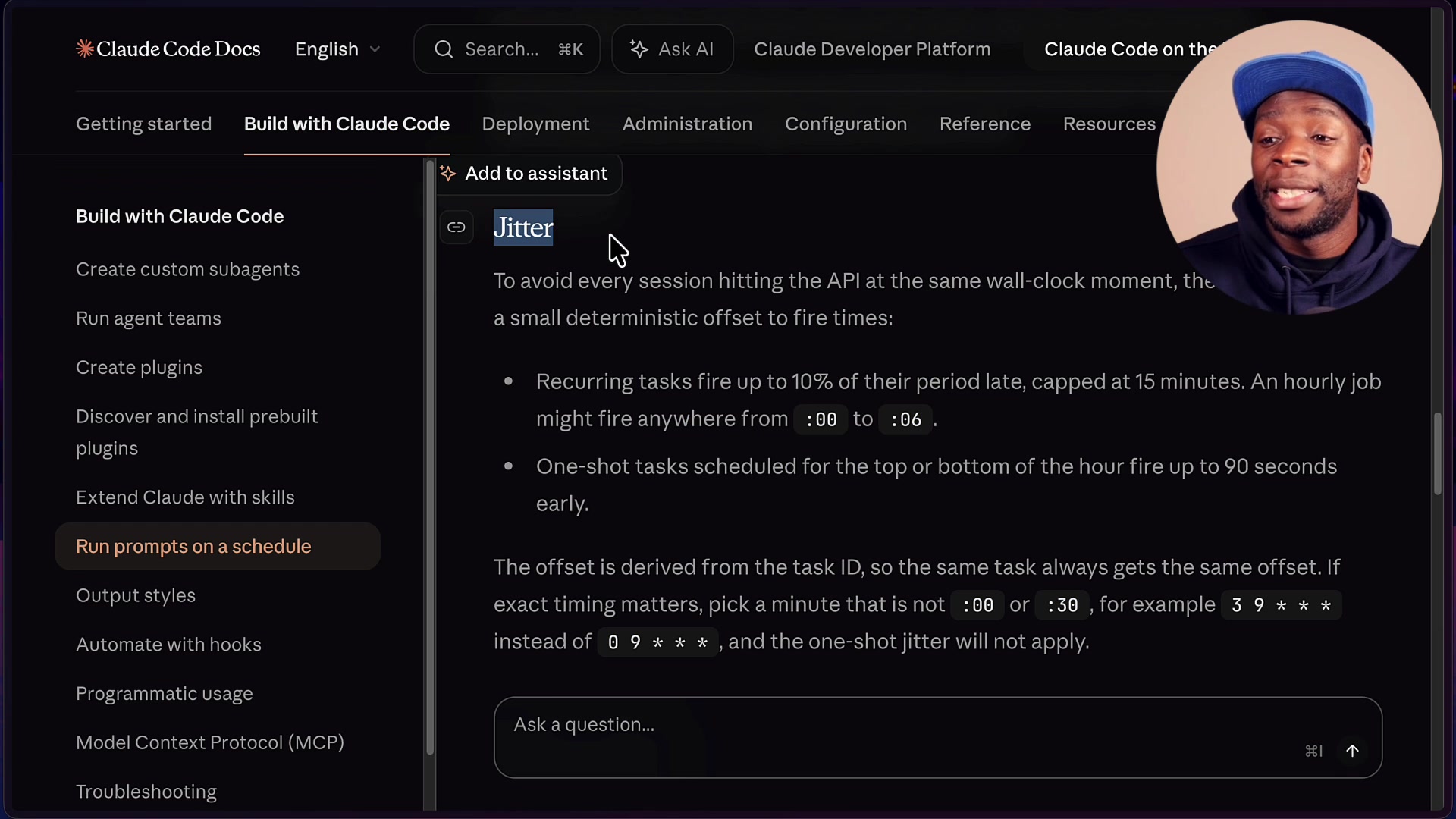 Claude Code documentation page explaining jitter, with bullet points describing its effect on recurring and one-shot tasks