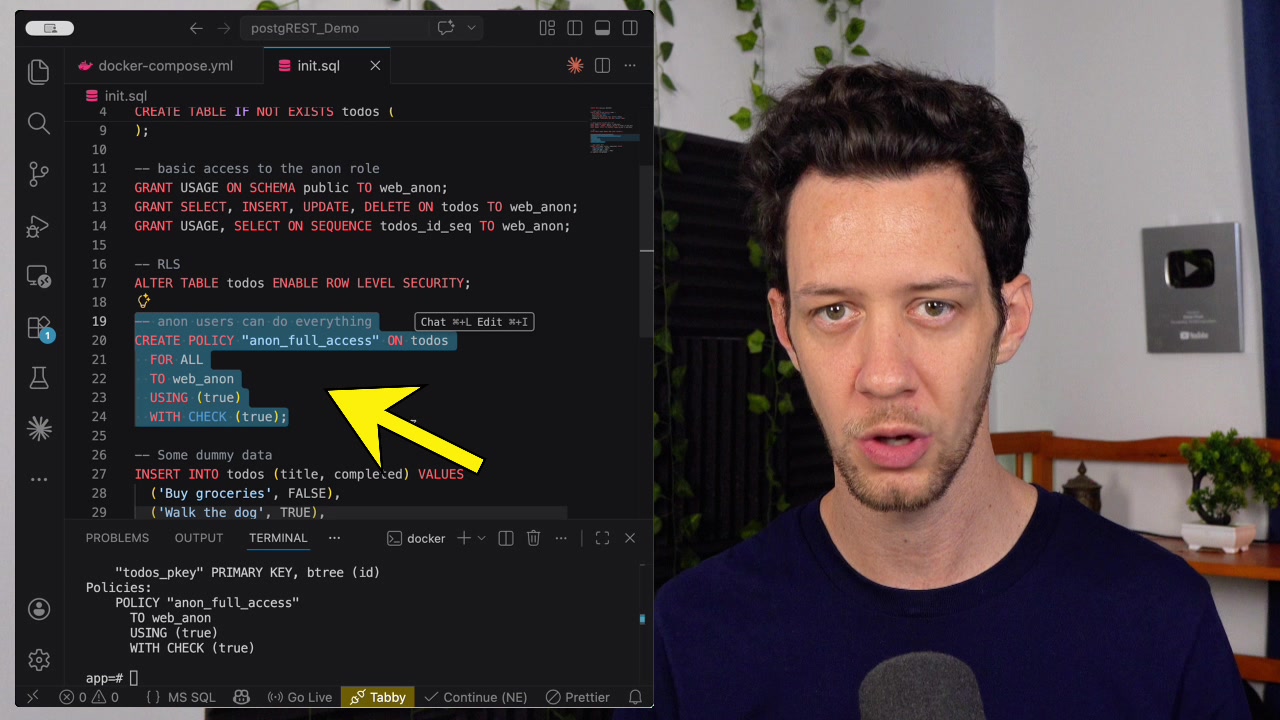 The CREATE POLICY statement highlighted within the init.sql file