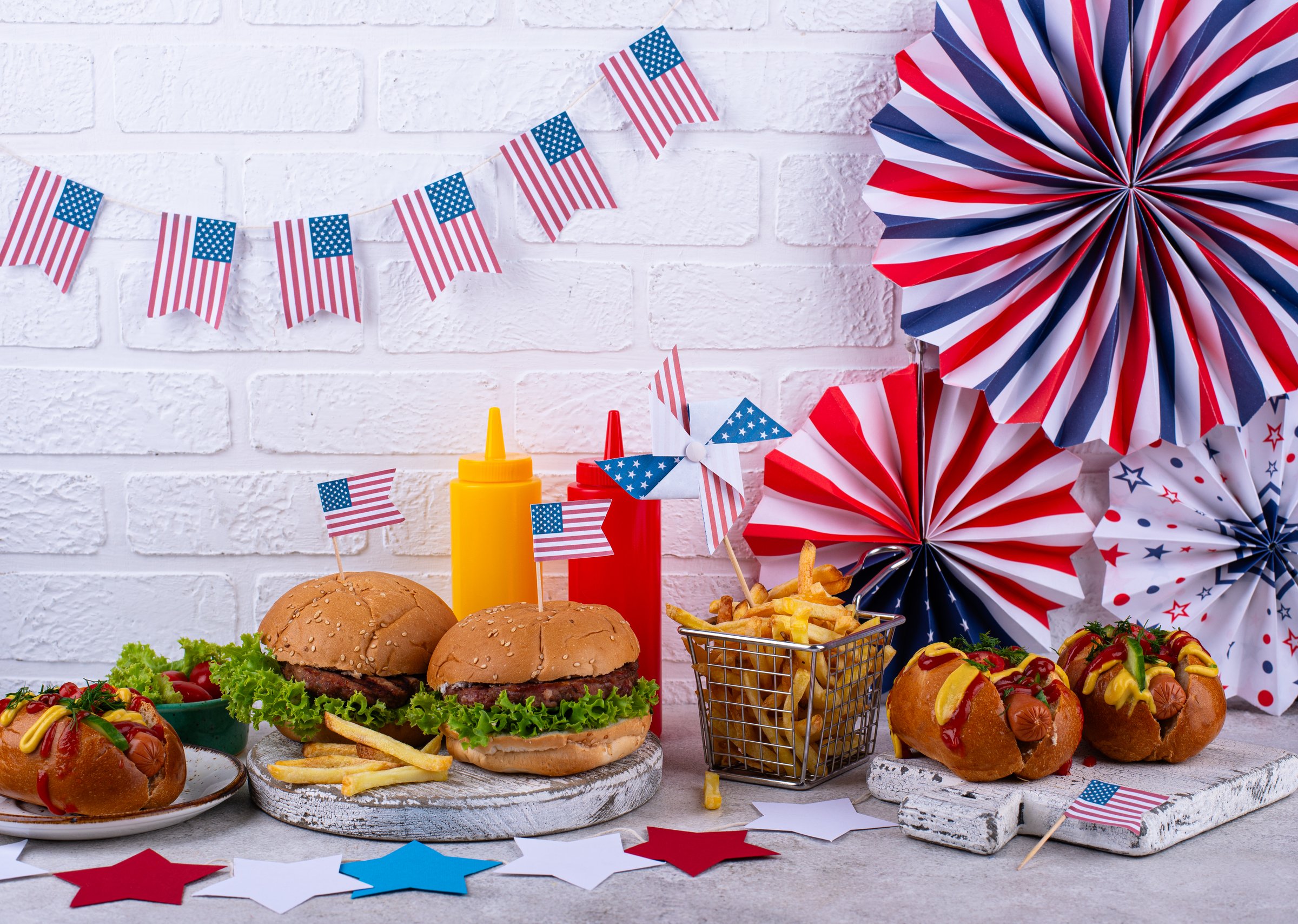 Traditional American food for celebrating July 4 Independence Day, USA Memorial Day or Labor day. Burgers, french fries and hot dog