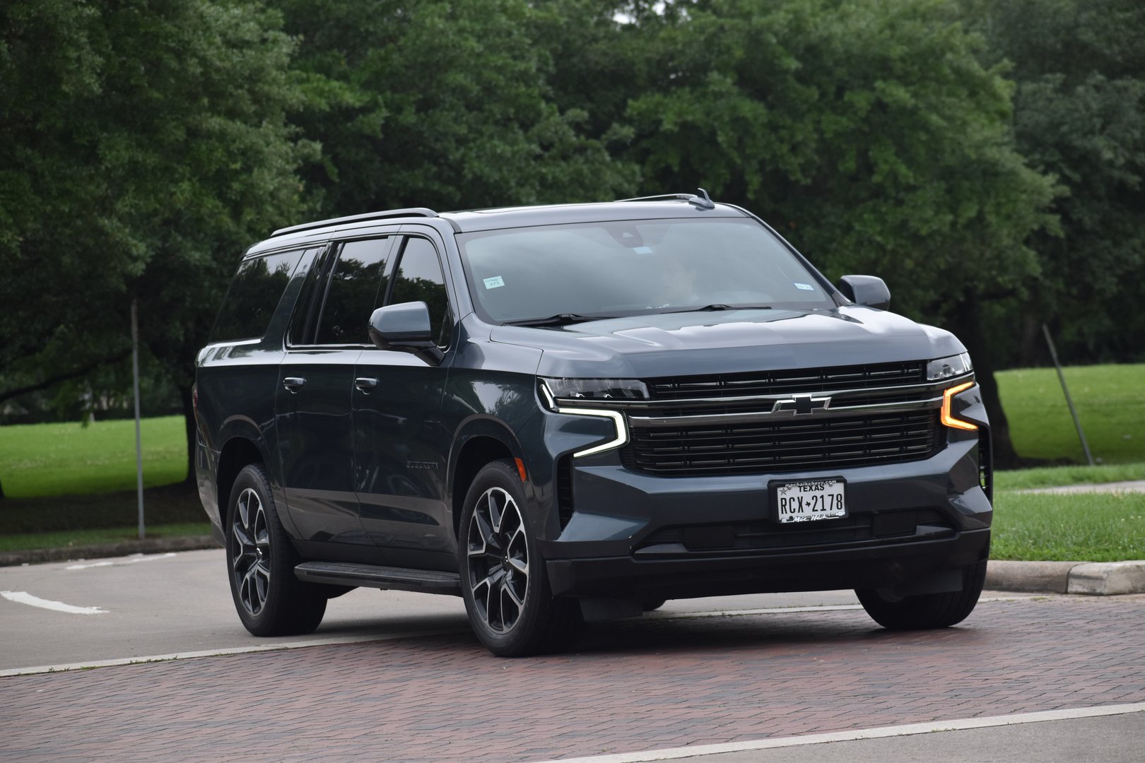 Houston, TX USA - A Chevy Suburban SUV cruising near a nature reserve