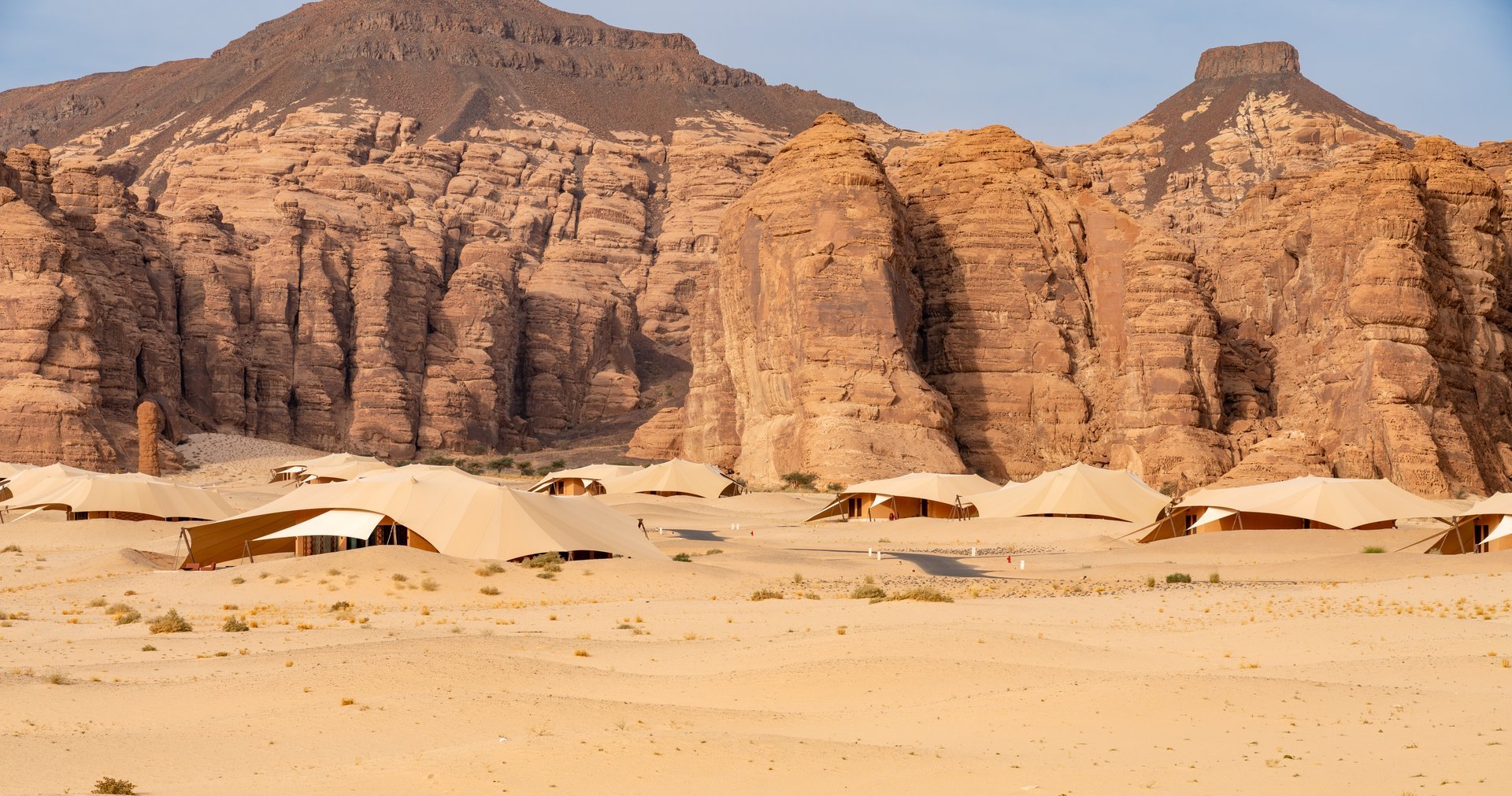 AlUla, Saudi Arabia - Sandstone formations of Ashar Valley provide a breathtaking backdrop for the luxurious resorts within amazing desert landscape of AlUla, Saudi Arabia
