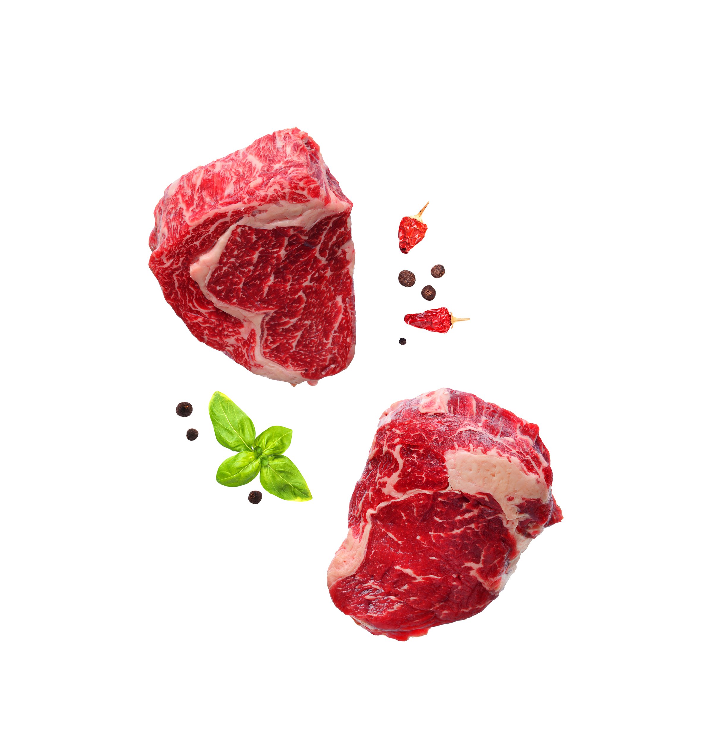 Raw marbled ribeye steaks isolated on white without shadows