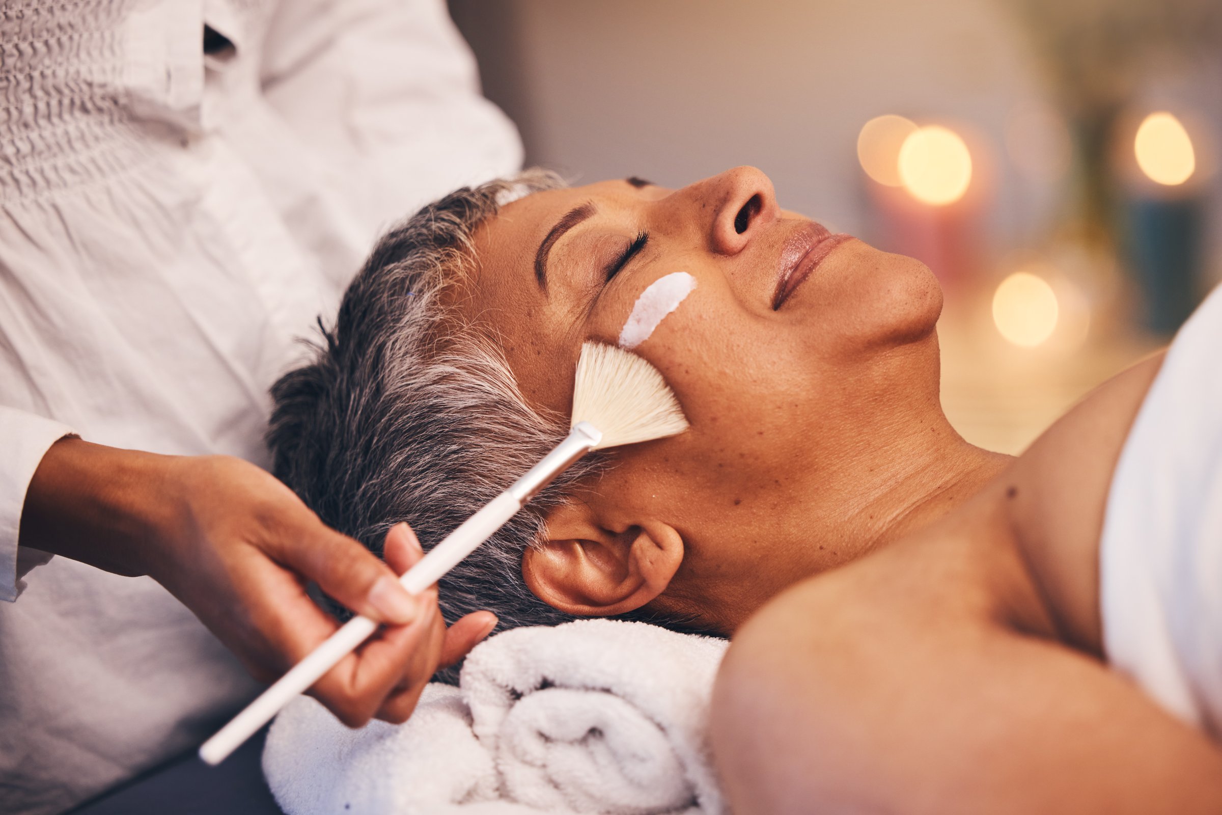 Facial relax and senior woman at a spa for wellness