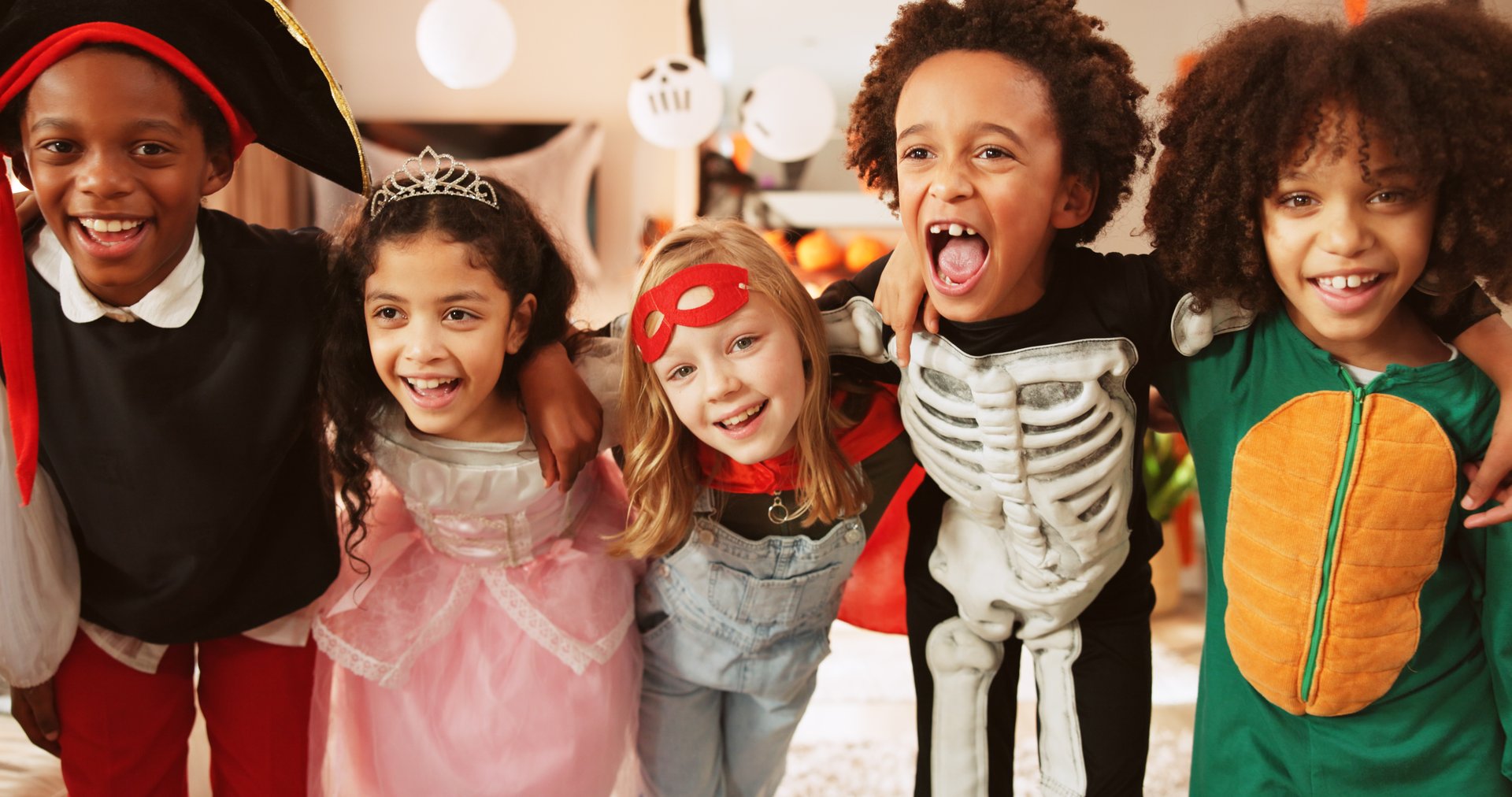 Happy children with costumes at Halloween party