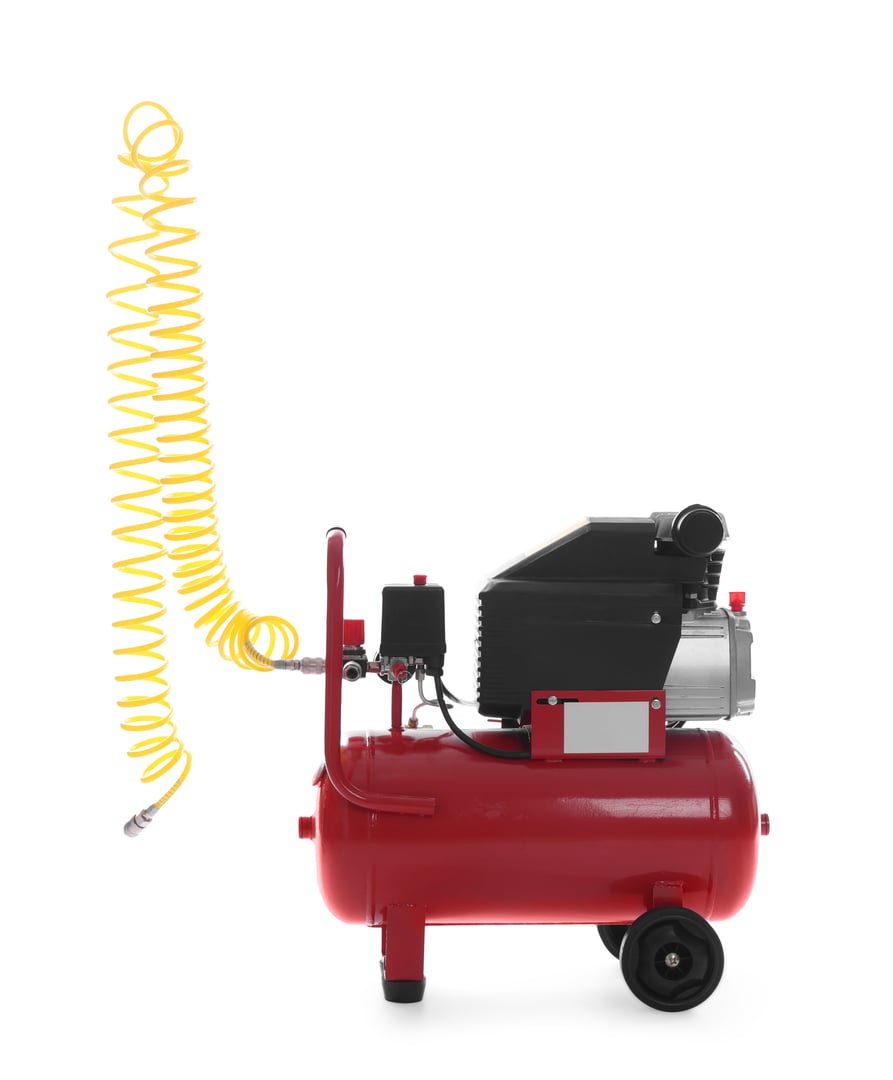 Air compressor with coiled hose isolated on white