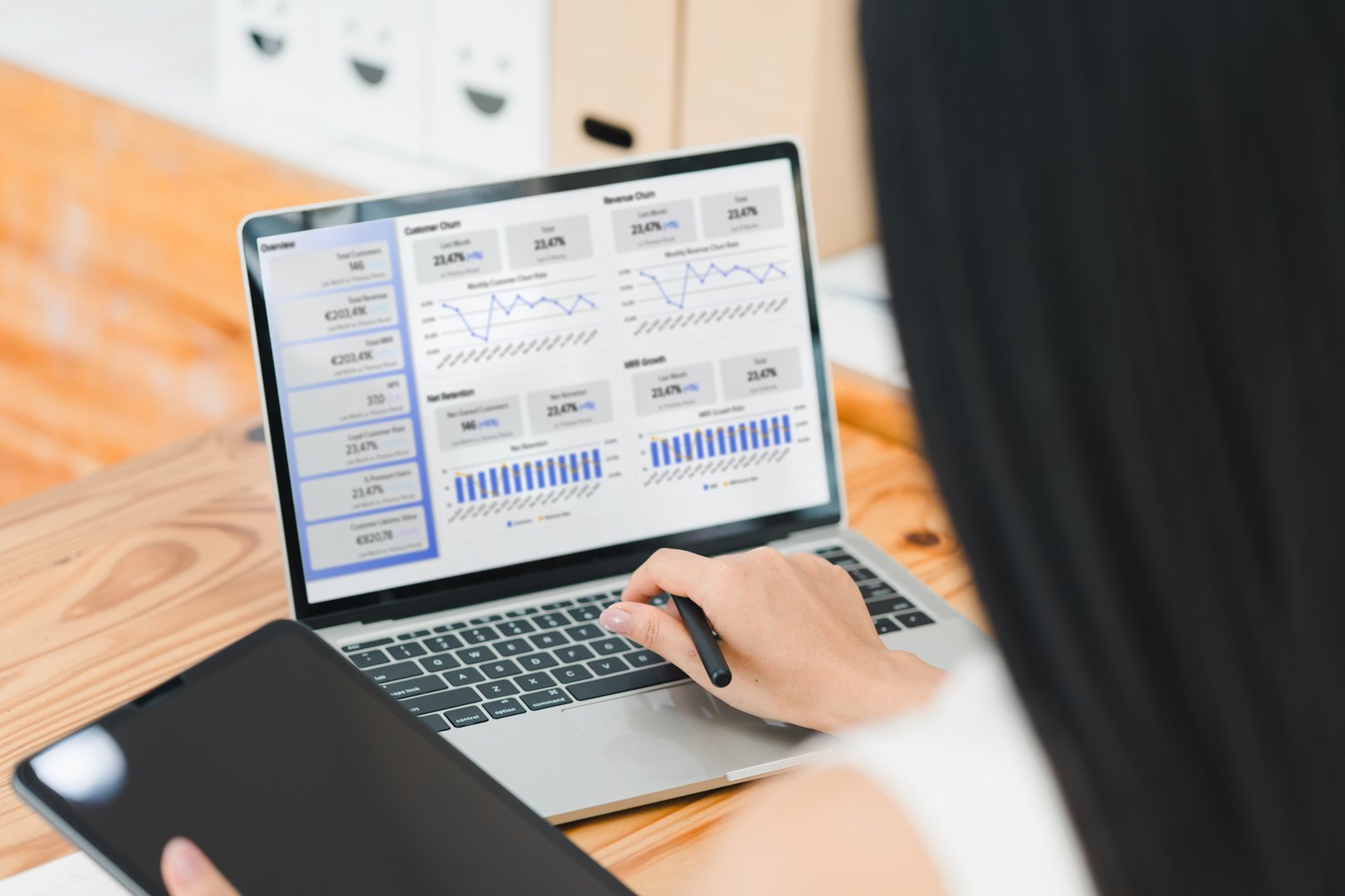 Data analysis is being conducted on laptop, showcasing various graphs and statistics. individual is focused on interpreting information, highlighting importance of data driven decision making.