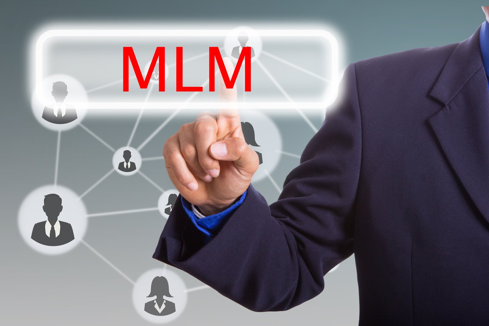 Businessman press MLM button for networking market with your hand