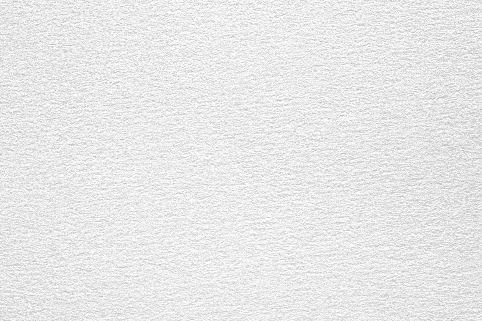 A close-up shot of a white watercolor paper texture with a subtle embossed pattern.