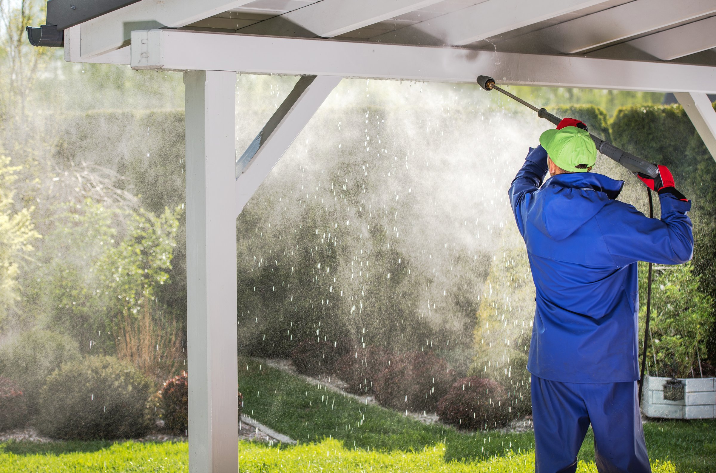 Porch Roof Power Cleaning. Caucasian Men with Pressure Washer.