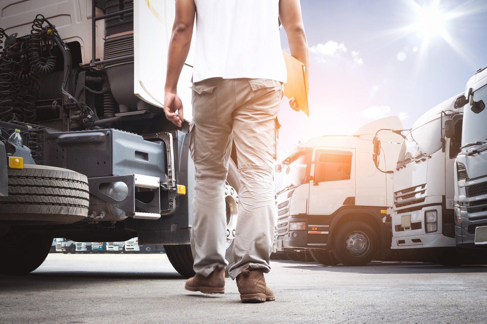 Truck Drivers Holding Clipboard to Check Truck Engine. Semi Truck Tractor, Big rig. Maintenance Safety Checklist, Inspection Safety Truck Driving. Freight Logistics Transportation.