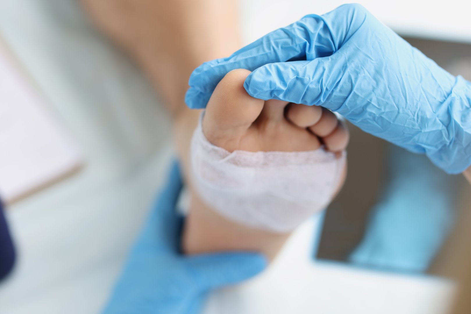 Doctor conducts medical examination of foot with patch. Pain attacks concept
