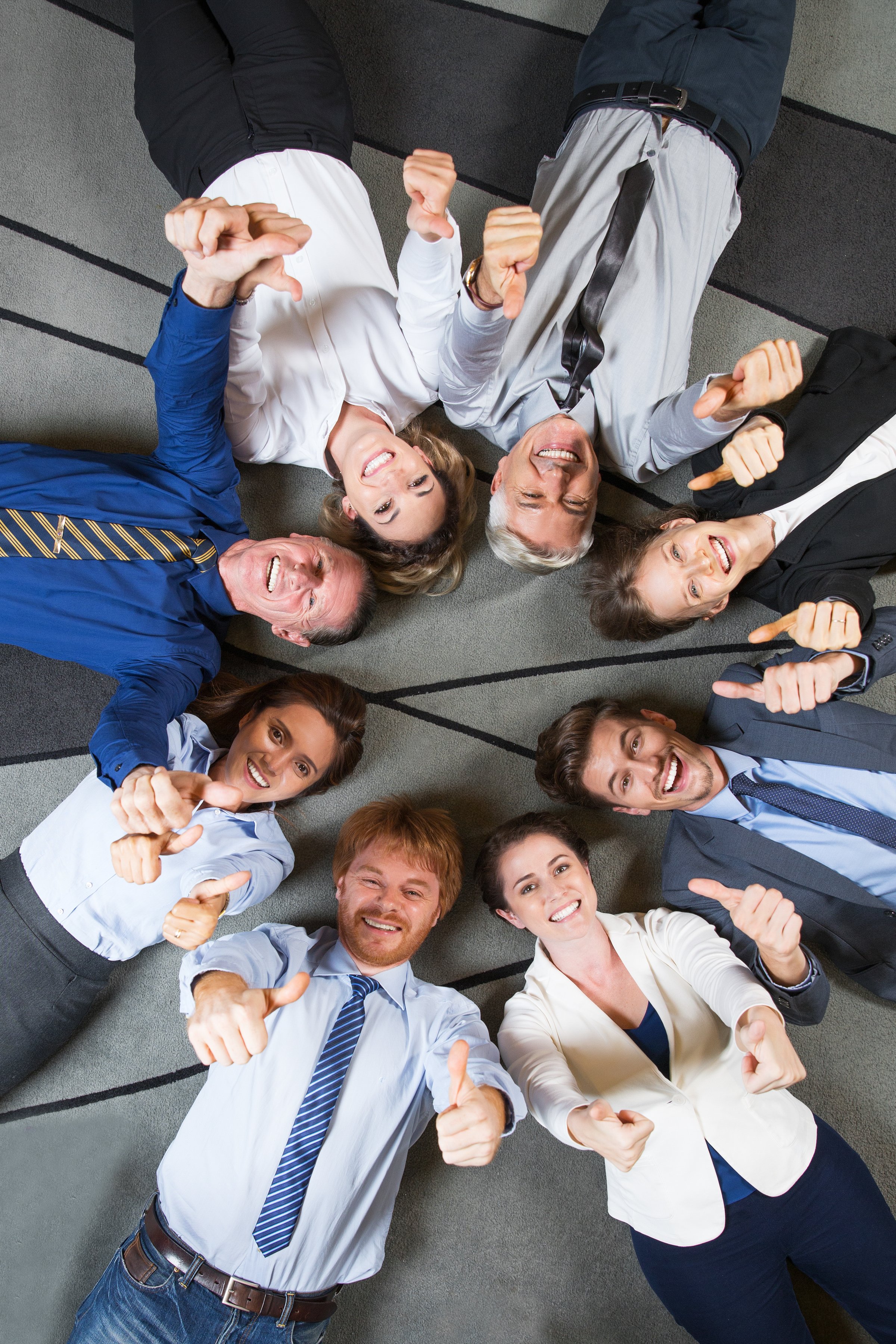 upload-cheerful-successful-business-team-with-thumbs-up.jpg