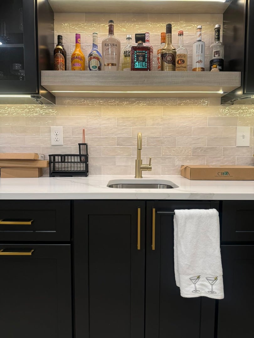 Finished basement with custom bar and entertainment area by Just Ask Home Improvement