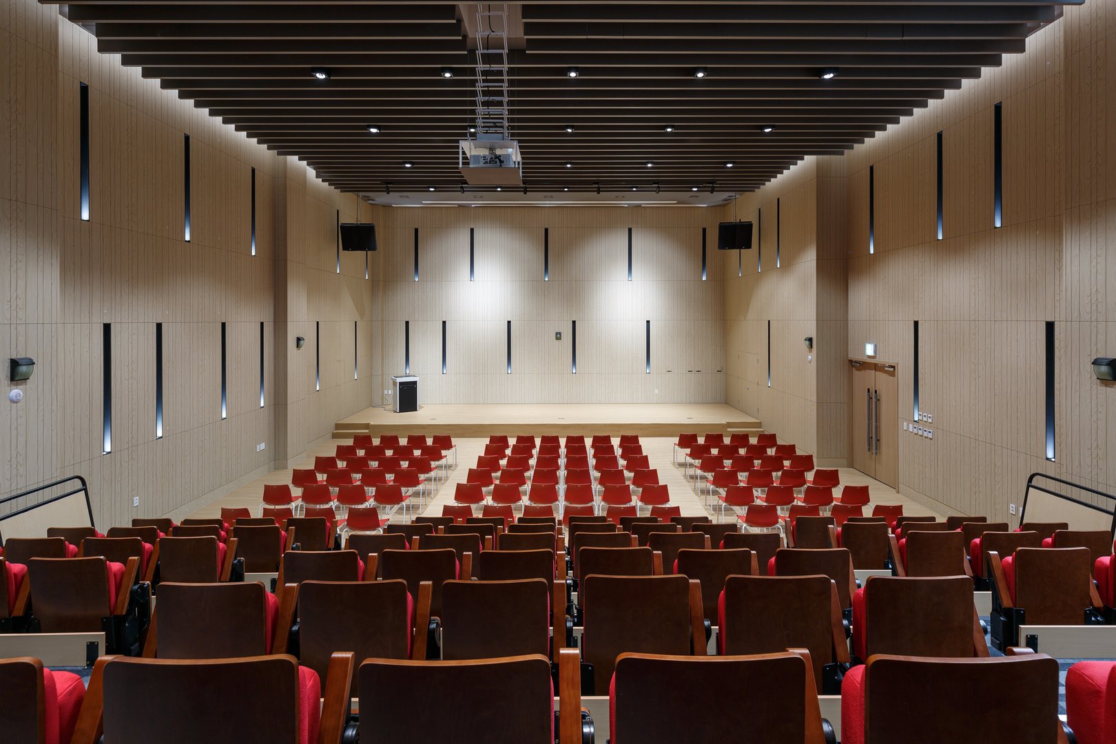 Auditorium interior with neat rows of empty seats