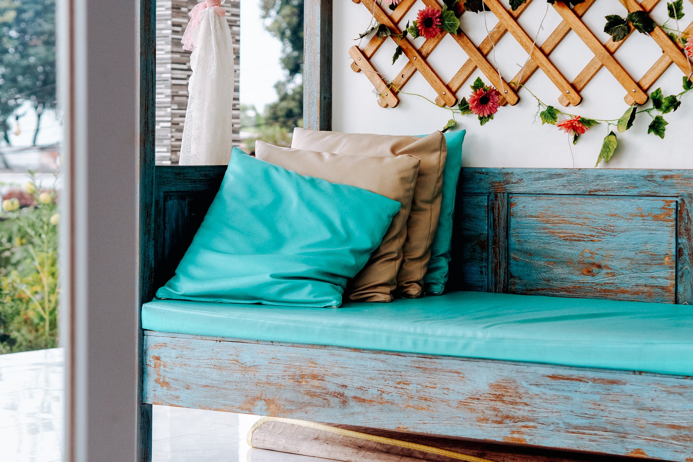 On a wooden bench, cushion backrest pillow