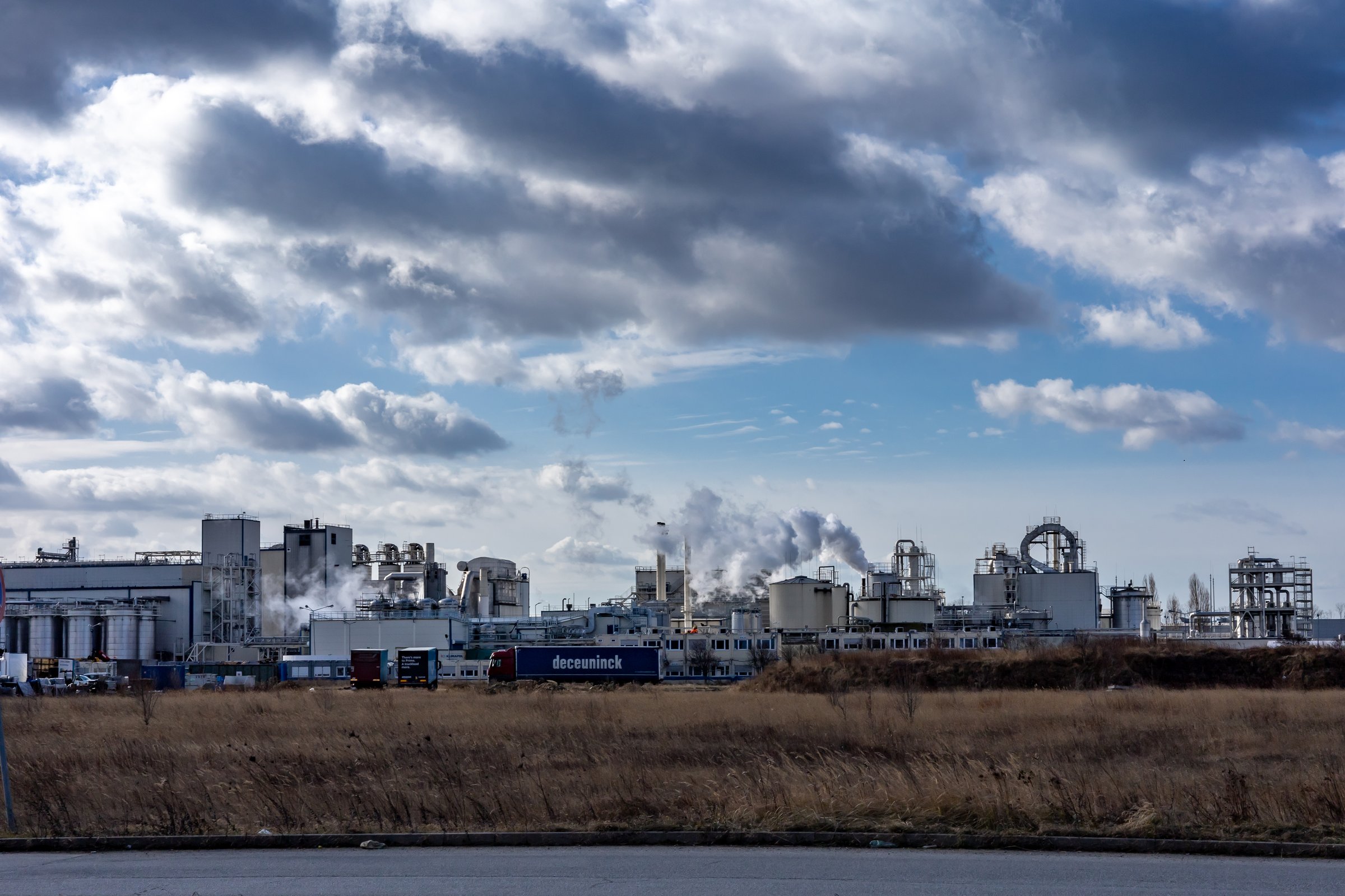 Wroclaw, Poland - February 19, 2022: Smoking chimneys of Cargill food corporation factory.