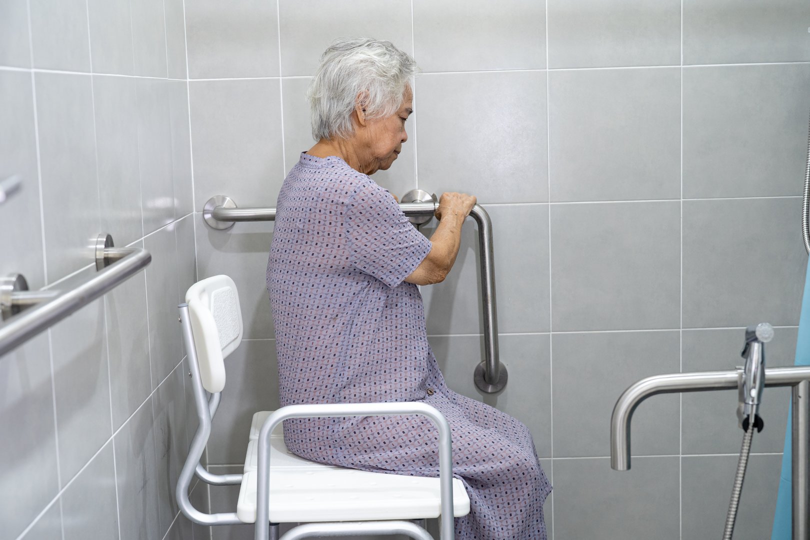 Asian senior or elderly old lady woman patient use toilet bathroom handle security in nursing hospital ward, healthy strong medical concept.