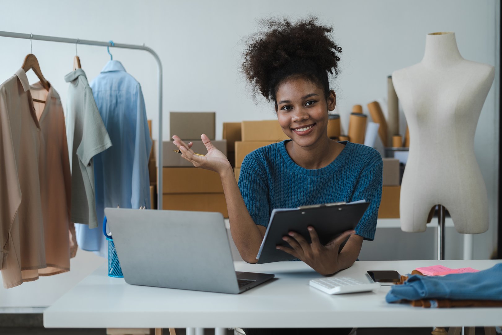Concept of selling products online.entrepreneur or freelance checking orders from customers, woman runs an e-commerce business on websites and social media.