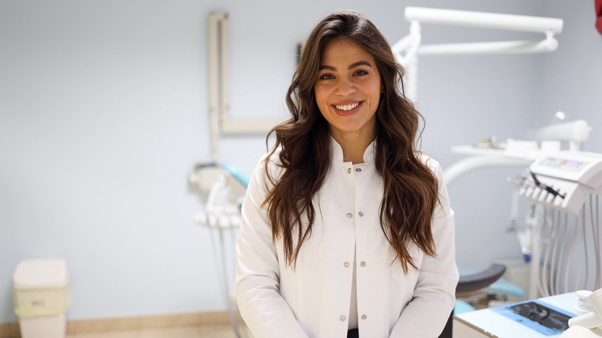 Portrait of a beautiful, young female dentist at her office