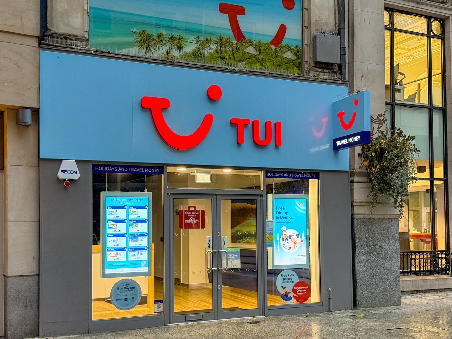 Cardiff, Wales - 6 October 2024L Front exterior view of the branch of TUI travel agents on Queen Street in Cardiff city centre.