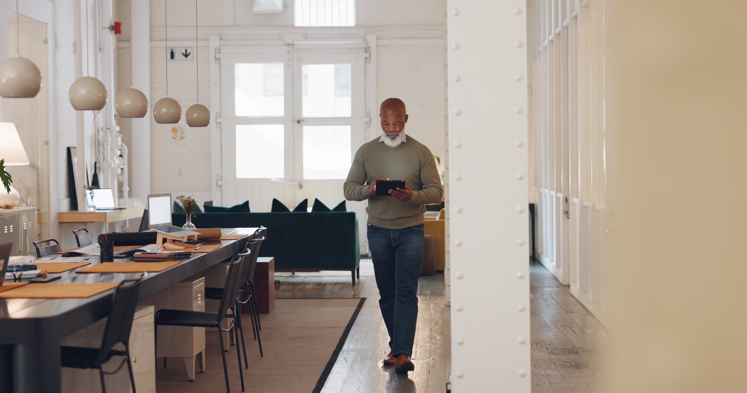 Tablet, real estate agent or real estate agent networking as a senior manager on digital website or selling property. Research, leadership or senior black man with kpi goals or growth mindset walking in hall