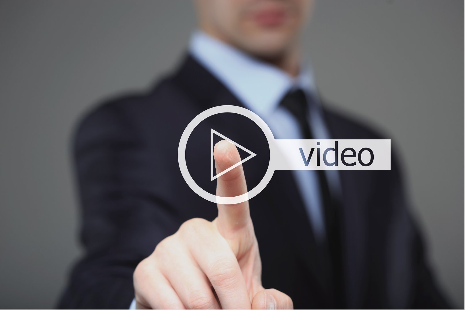 Businessman pressing play button to start or initiate projects