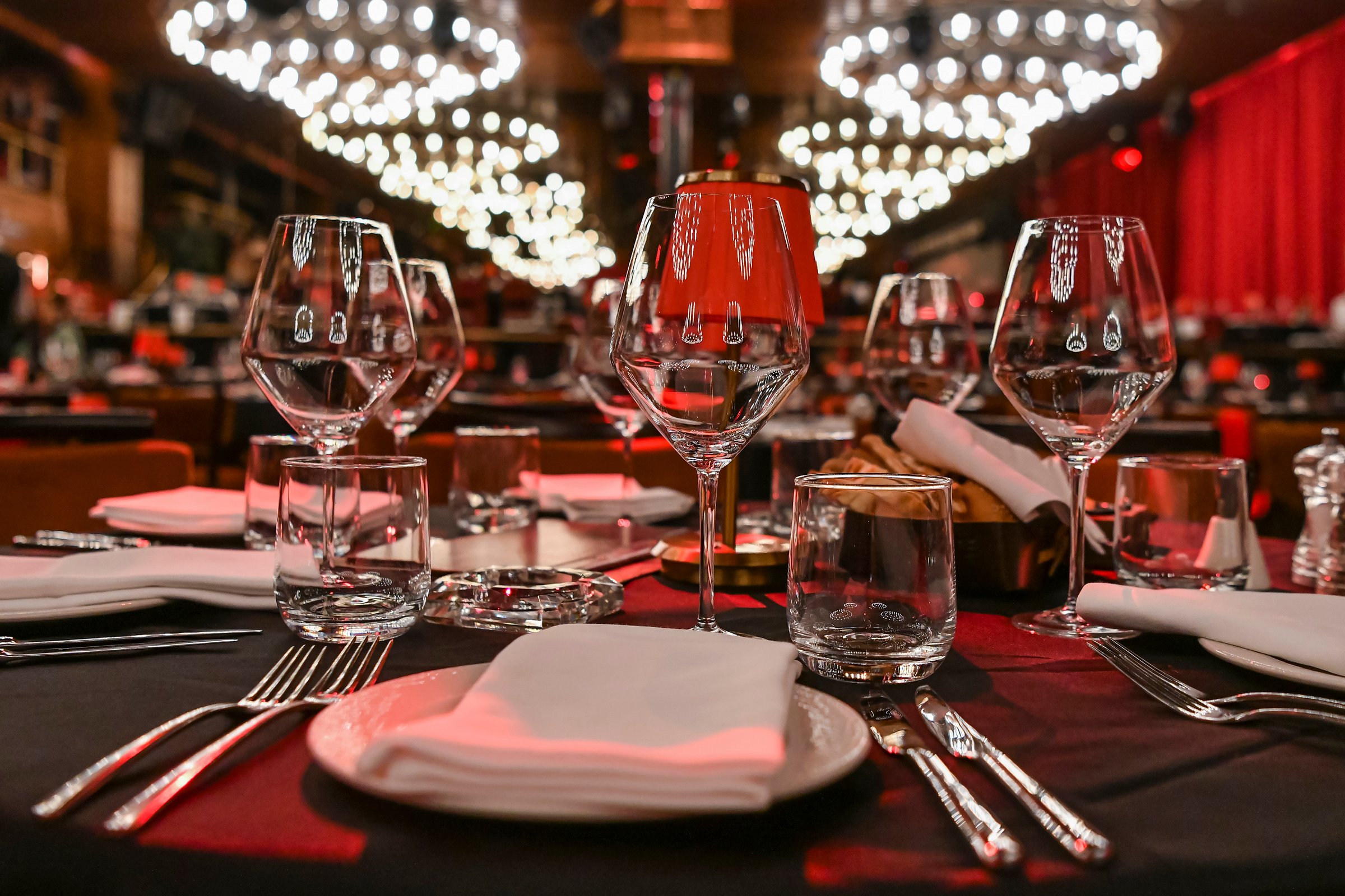 luxury elegant red table setting for dinner in a restaurant