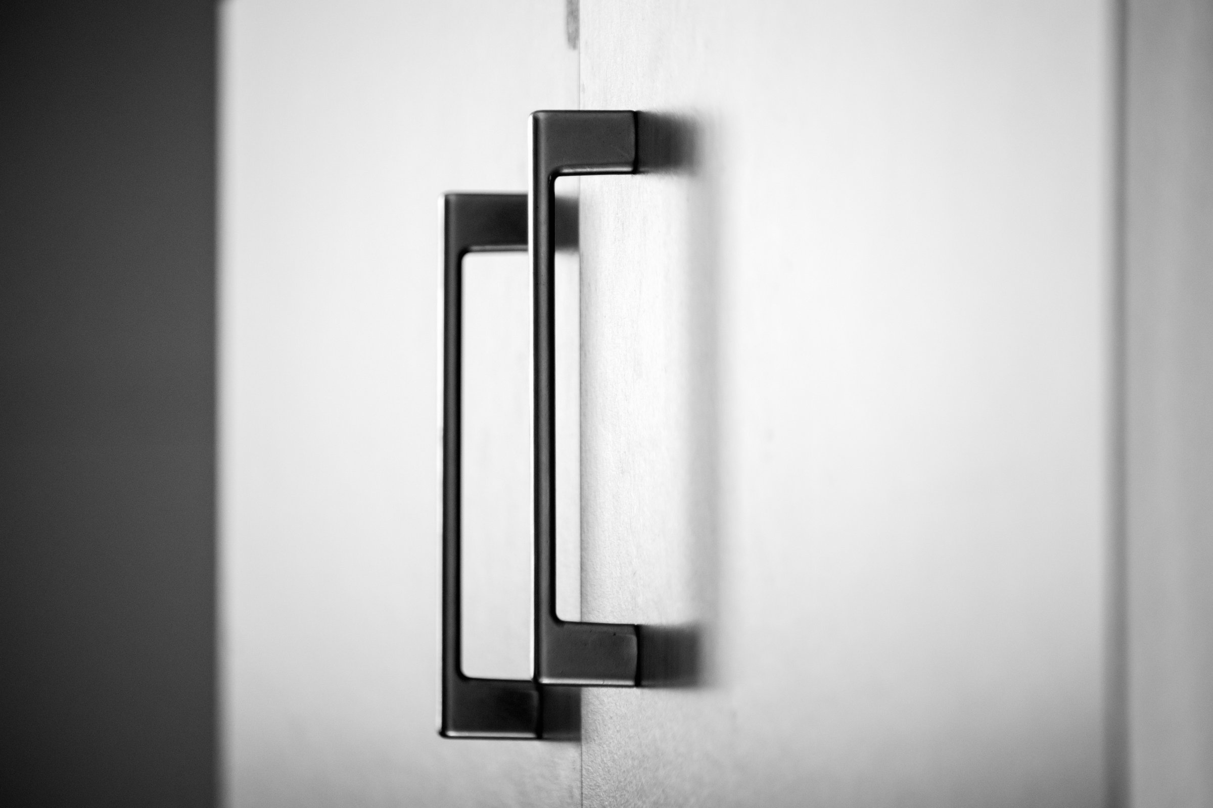 cupboard door handles, office environment detail.