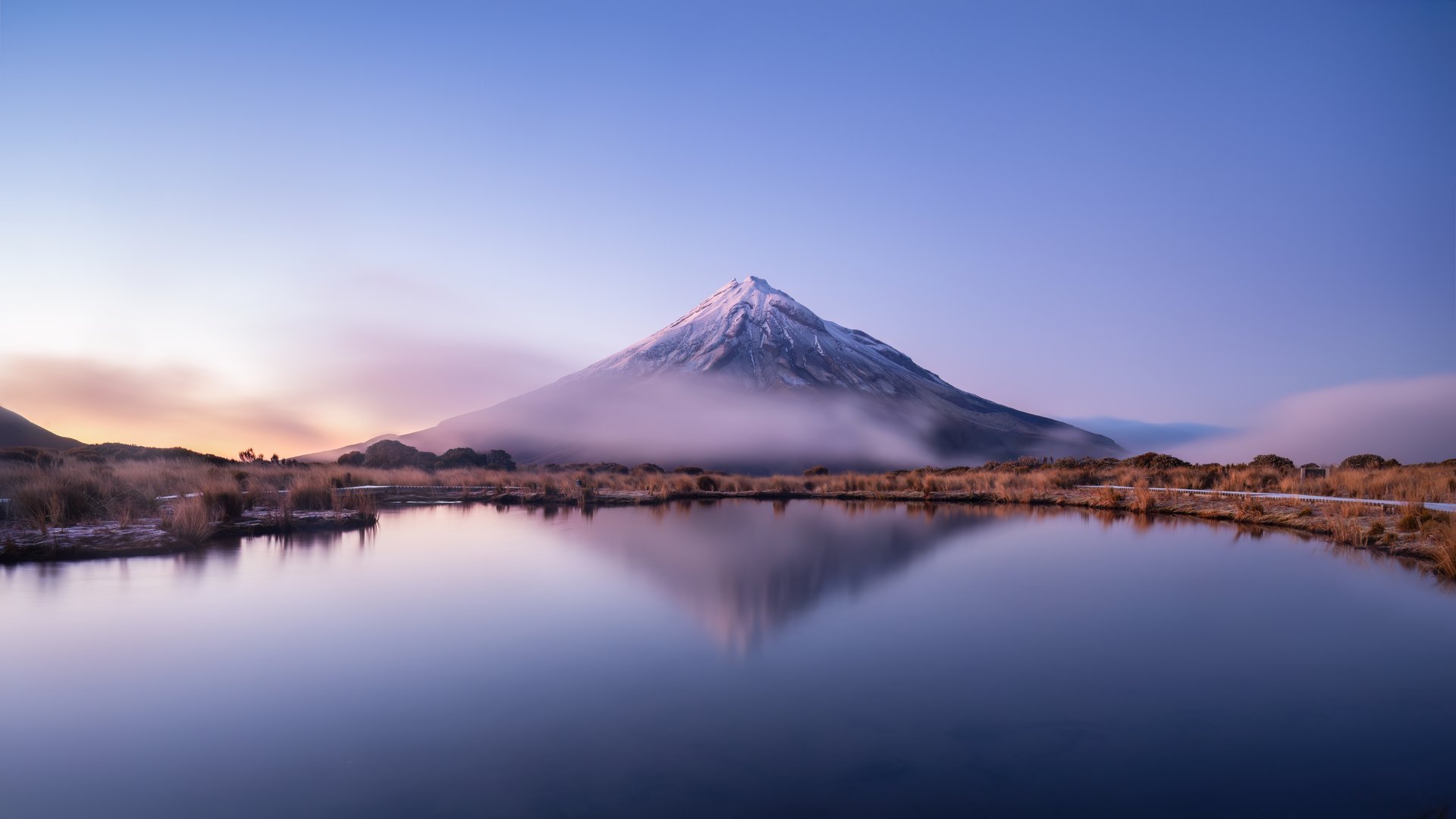 Mt Taranaki reflected in the Pouakai tarn at dawn, New Zealand.