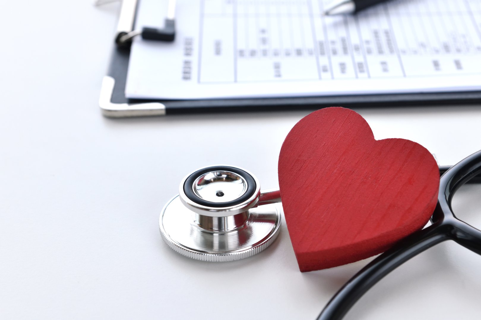 Stethoscope and heart object on desk