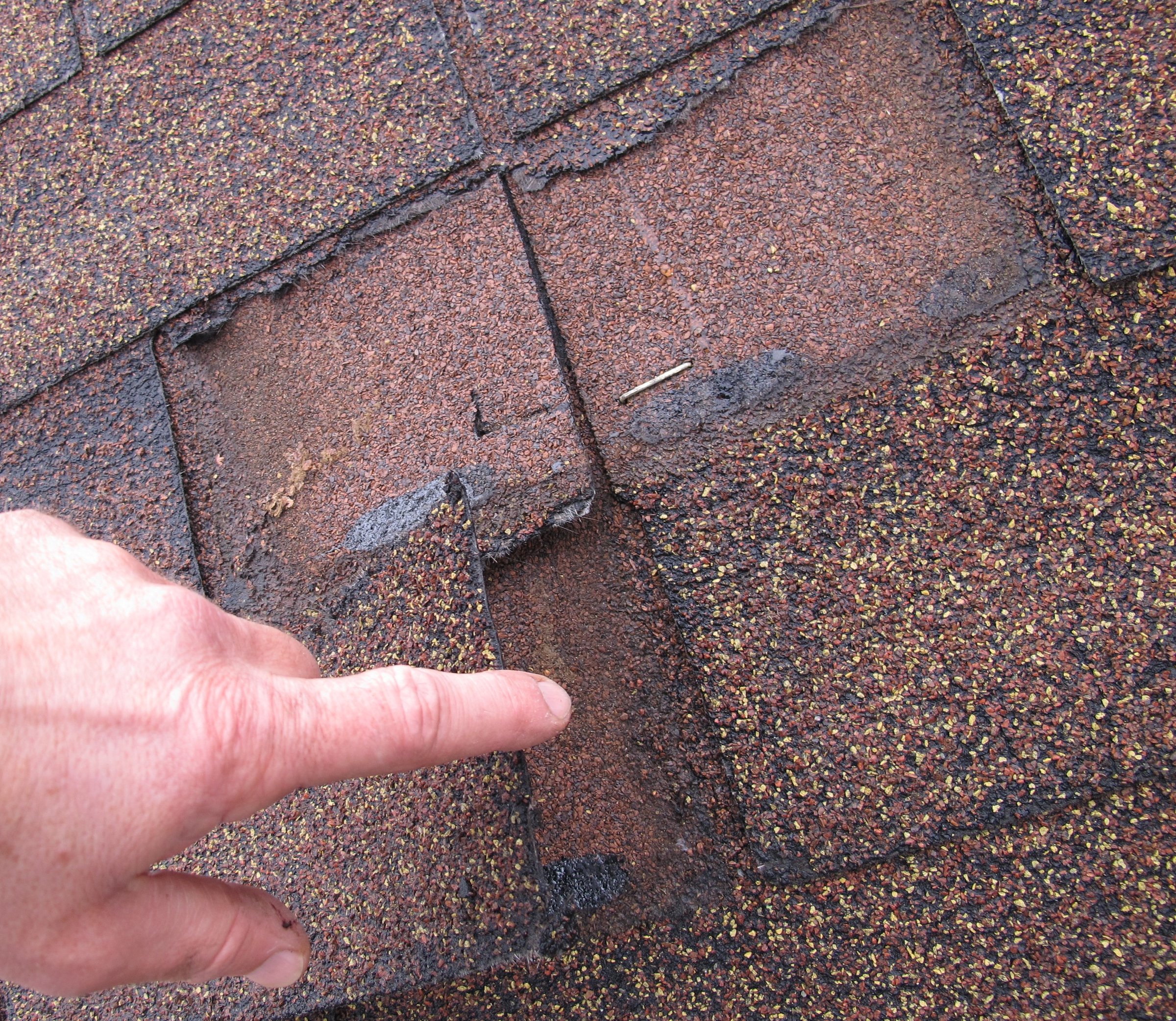 Damaged roof seams and joints showing failure points for leaks