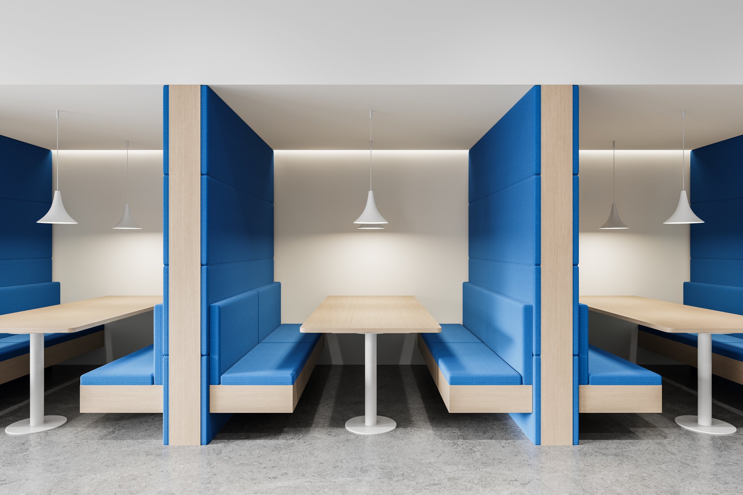 Contemporary office interior featuring blue padded booth seating with wooden tables and white pendant lights, set against a neutral background. 3D Rendering