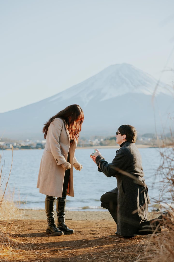 Couple holding hands proposal moment