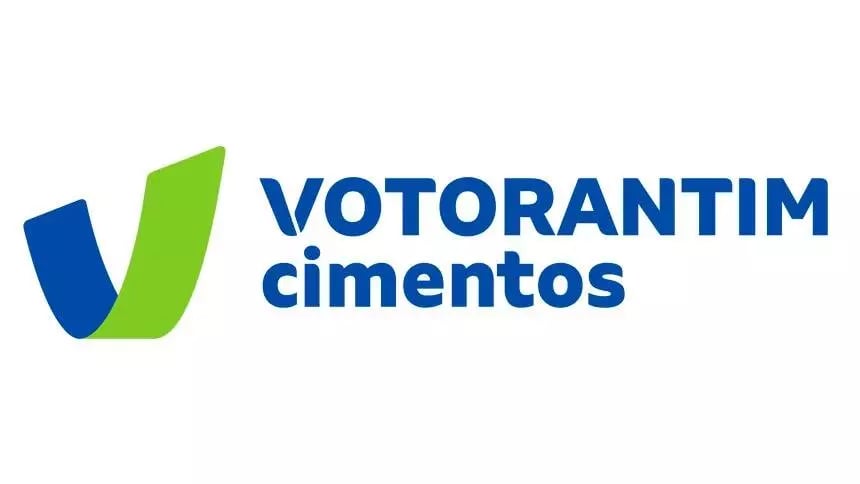 Logo of Votorantim Cimentos with a green and blue checkmark symbol and the companys name in blue text.