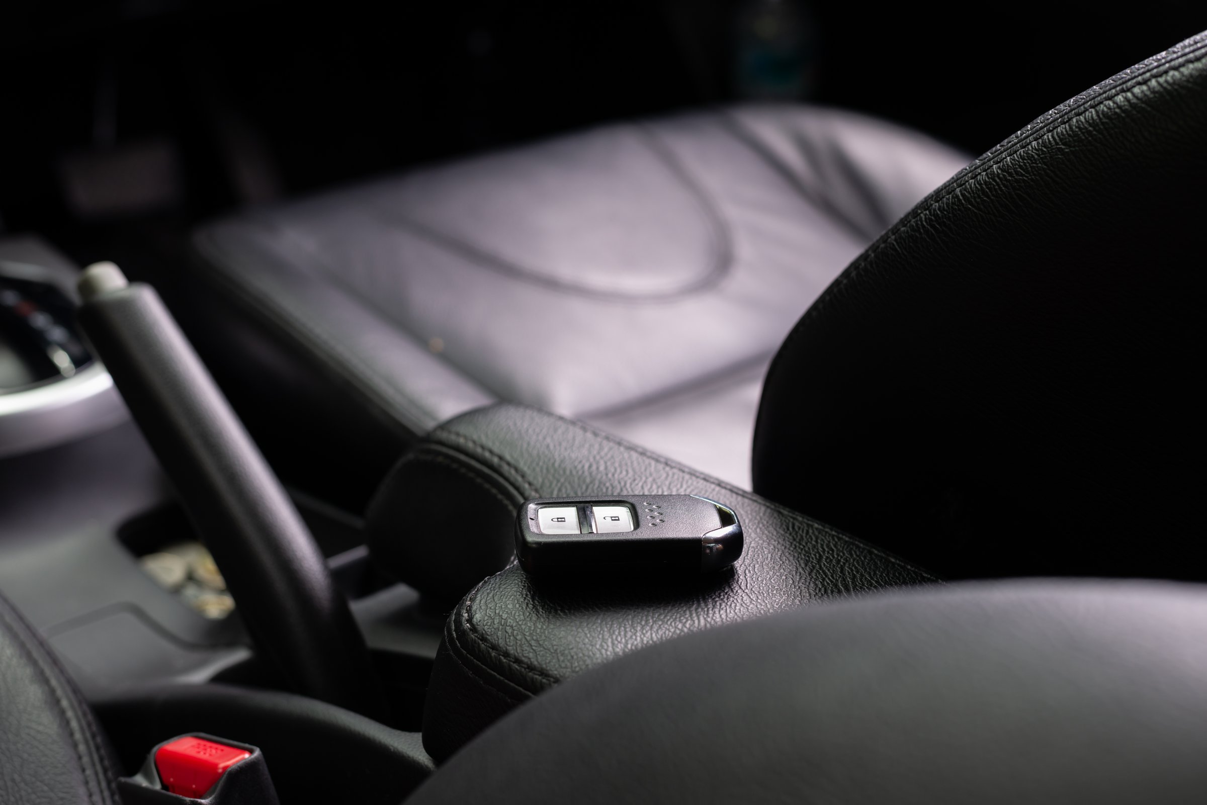 Car key with remote control black in vehicle interior